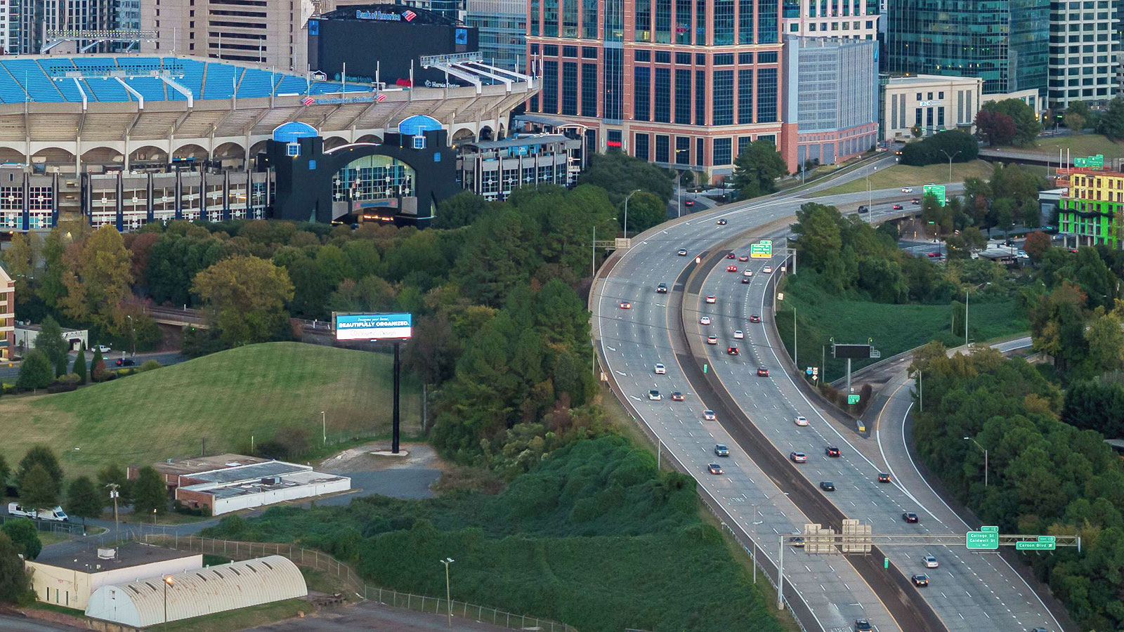 Aerial view of Charlotte skyline and Bank of America Stadium at dusk, North Carolina, USA.
